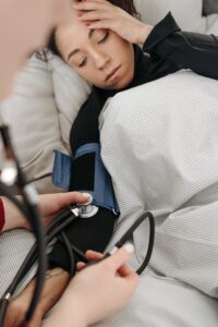 image of woman having her blood pressure checked